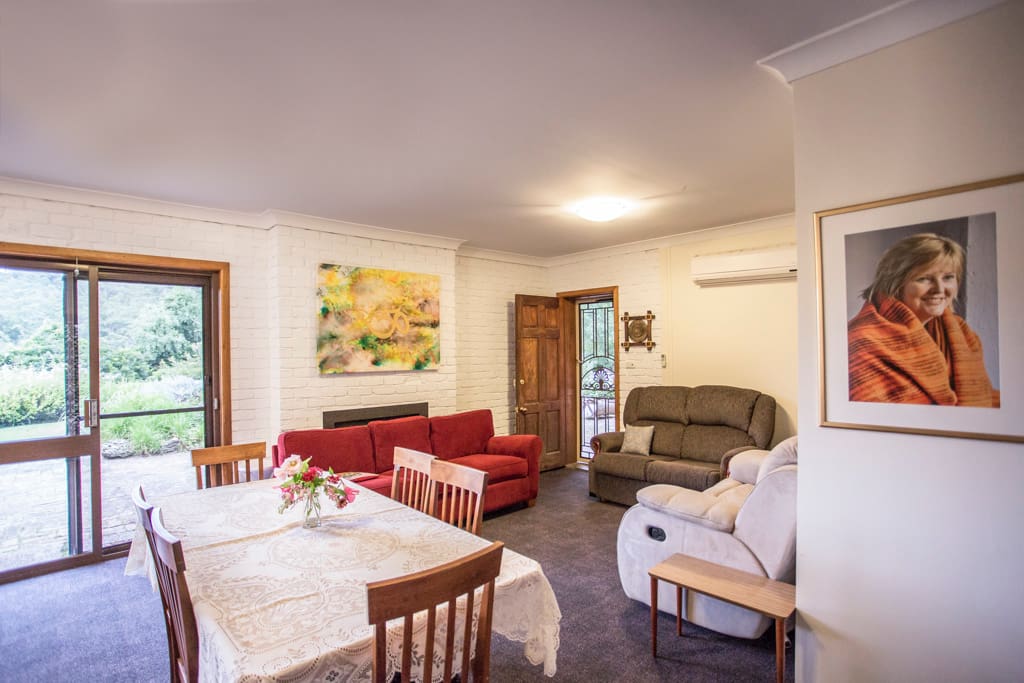 Common area, combined lounge dining room leading onto patio and gardens.
