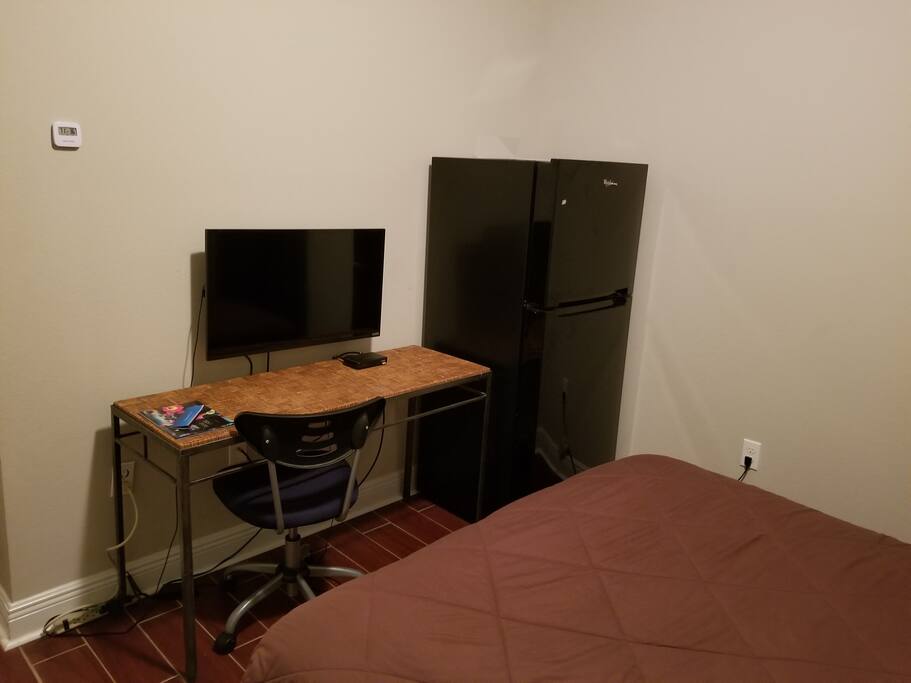 Directv and full size refrigerator in your room!