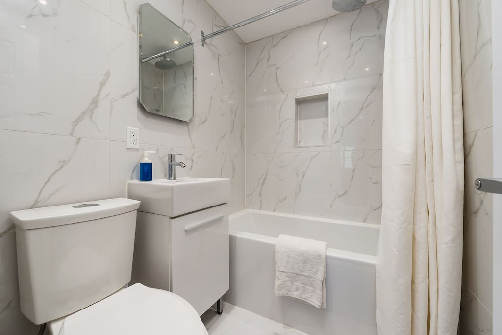Gorgeous bathroom with towels, shampoo, soap