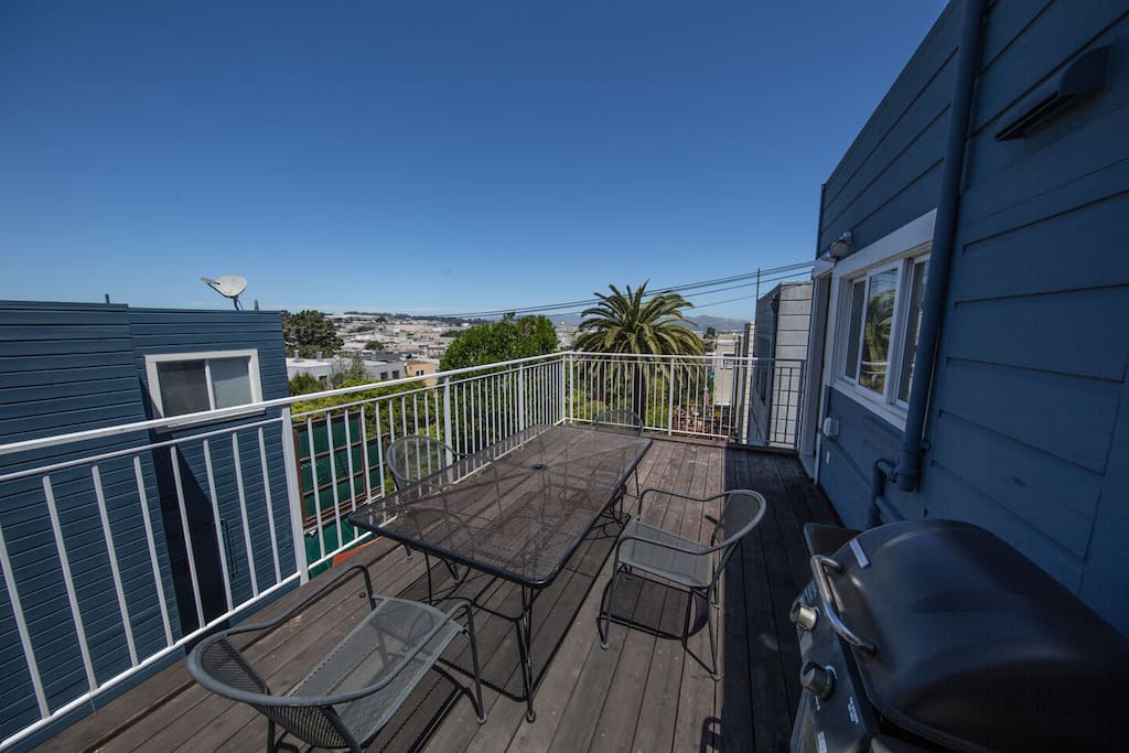 The DECK! Stocked with grill and patio furniture. Beautiful views of the Richmond district. On a clear day you can see the Golden Gate Bridge.