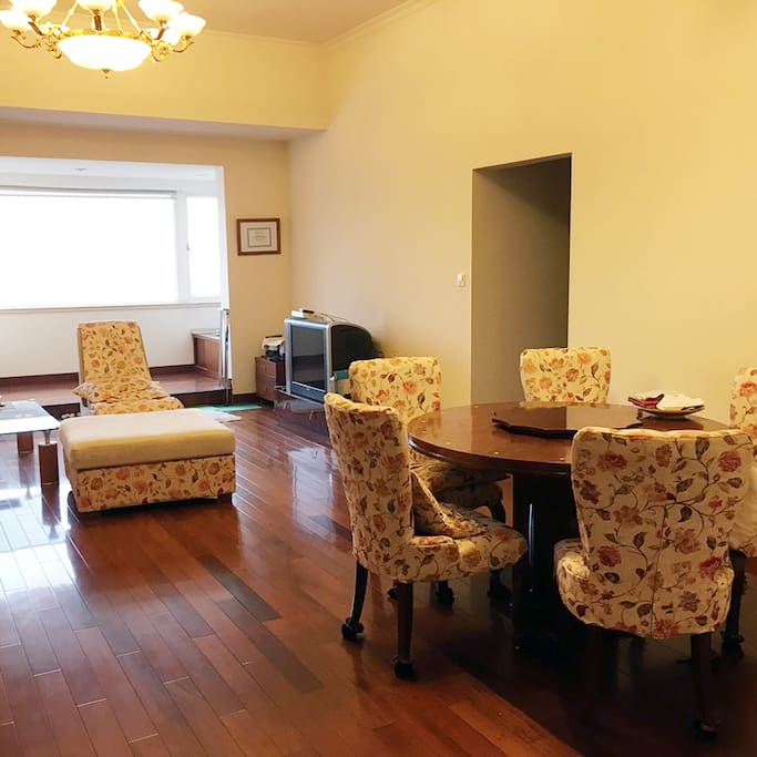 Living room and the dining area. Hallway leads to the two bedrooms.