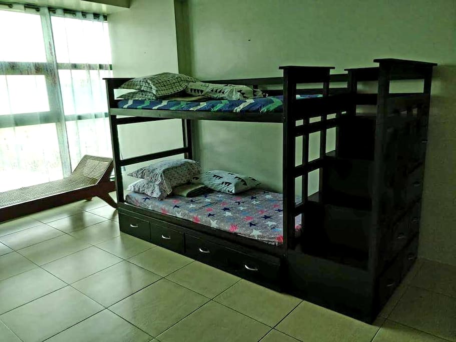 with double deck bed, another one under pulling bed