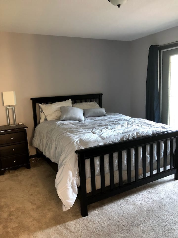 Bedroom 2 (queen) upstairs with balcony, TV
