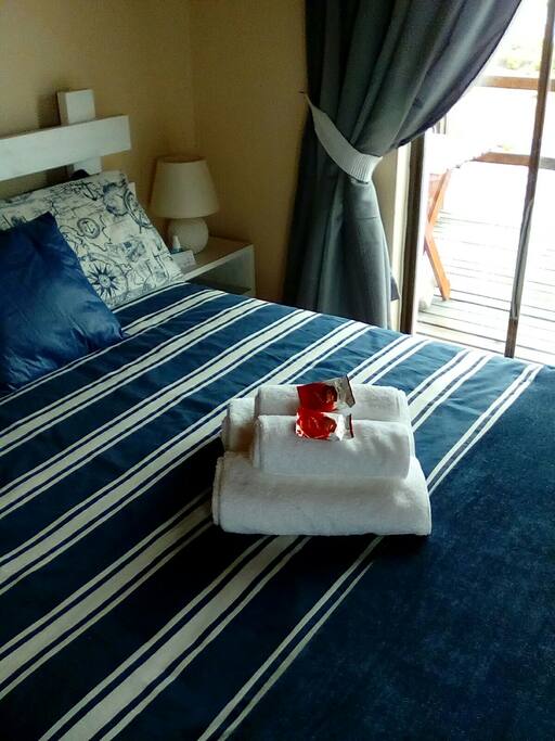 Main bedroom with balcony access.