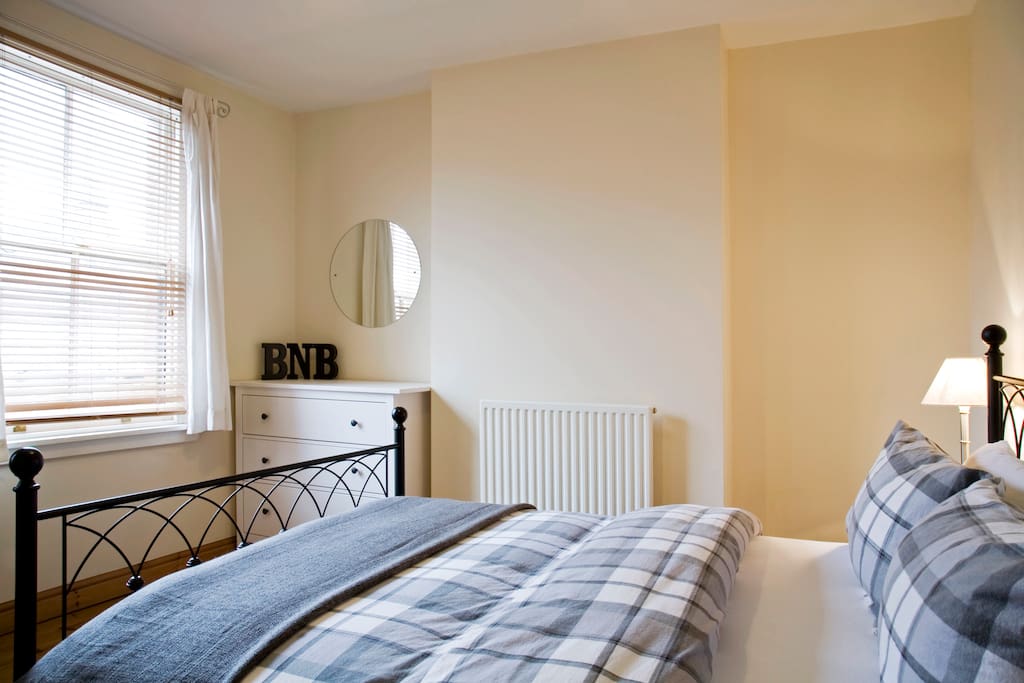 Master bedroom. The windows look over the main road - a quiet cul-de-sac.