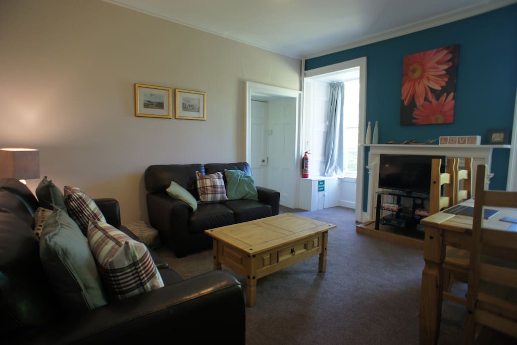 Lounge with dining area, large flat screen television and free unlimited WI-FI. Double sofa-bed