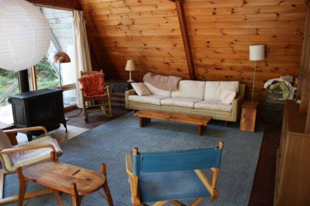 View of the living room of our lovely A frame first floor. Gas stove heats the whole house.