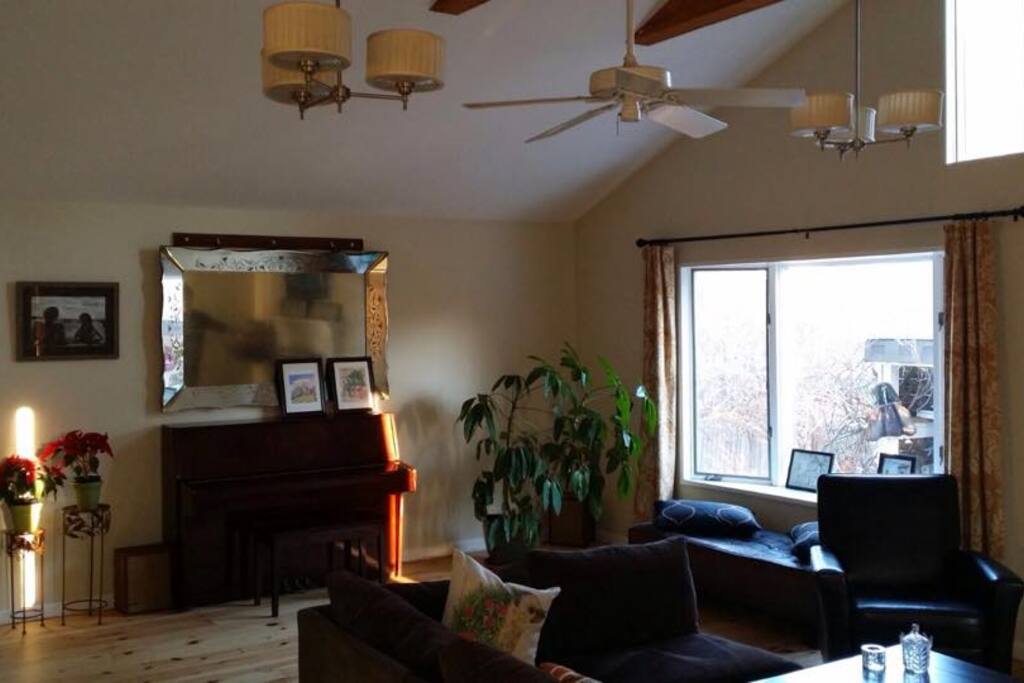 Spacious living room with big windows and natural lighting