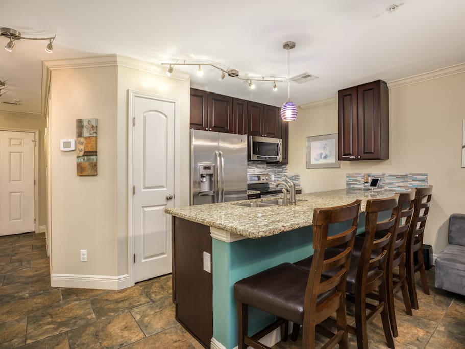 A granite counter doubles as a dining space.