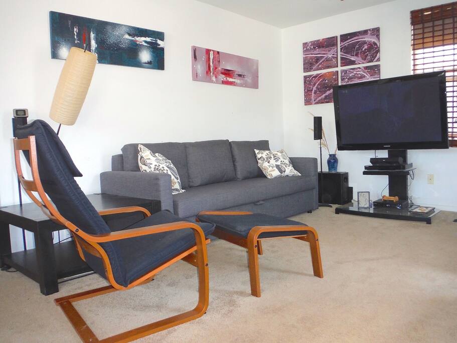 Comfy Ikea chairs with deluxe queen sofa bed .