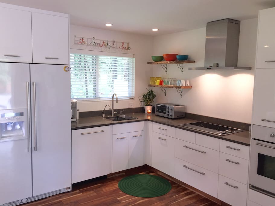 Full chefs kitchen; Ceasarstone Quartz counters, electric cooktop, Instahot for your tea or French press coffee, filtered water - everything is new, modern and clean!