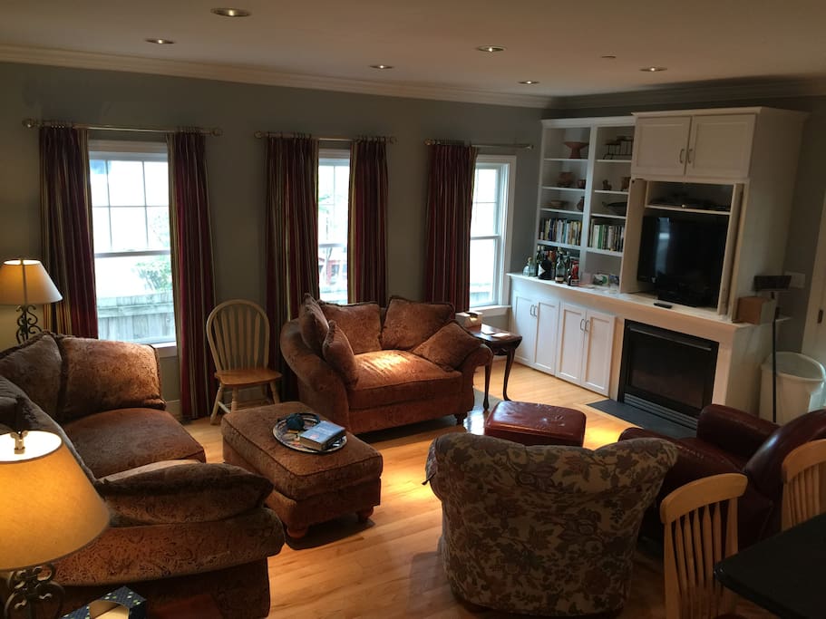 Living room w/fireplace & big screen TV.