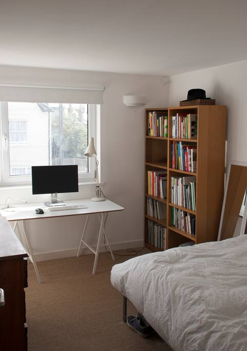 Double bedroom with chest of draws and desk.