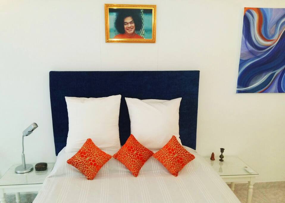 Queen size bed with a beautiful headboard and continentals to help you relax