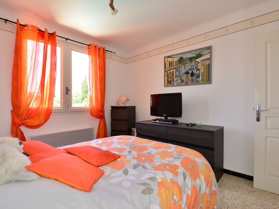The bright and sunny double bedroom with its own flat screen TV