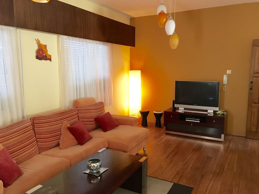 A spacious colorful living room and a plasma TV with Satellite and local channels!!