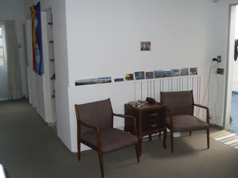 View of the living and access to patio and kitchen