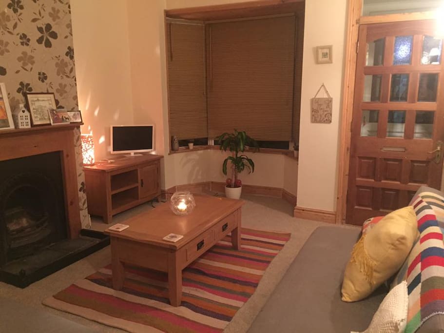 The cosy living room has two comfy sofa beds.