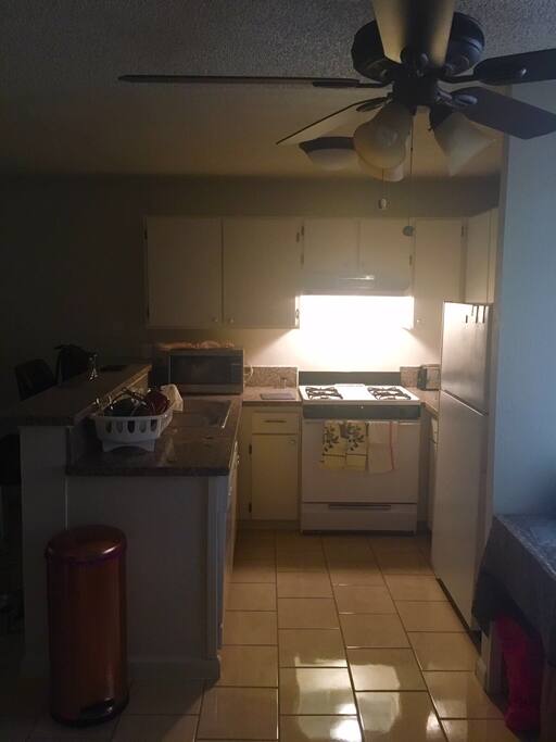 This is the full kitchen with all the amenities pots pans dishes seasonings olive oil oatmeal cereal for breakfast eggs and potatoes whatever you like or there's a supermarket across the street we can buy whatever you like and a swap meet
