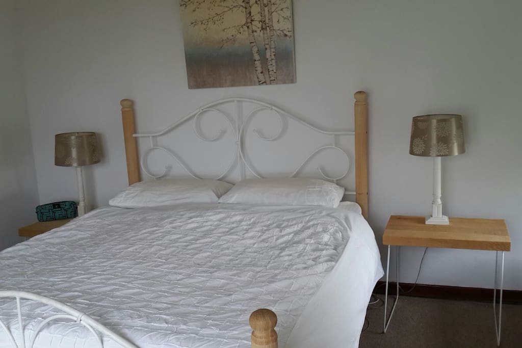 Main bedroom, with ceiling fan and en suite bathroom.