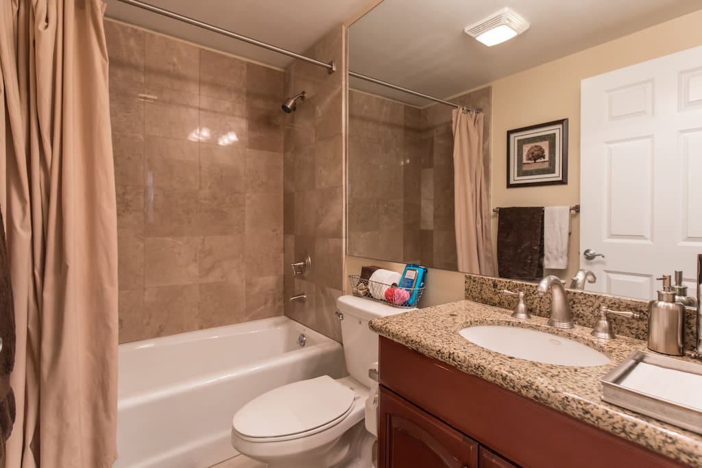 Private bathroom located about 4-5 steps away from bedroom. Robes provided.