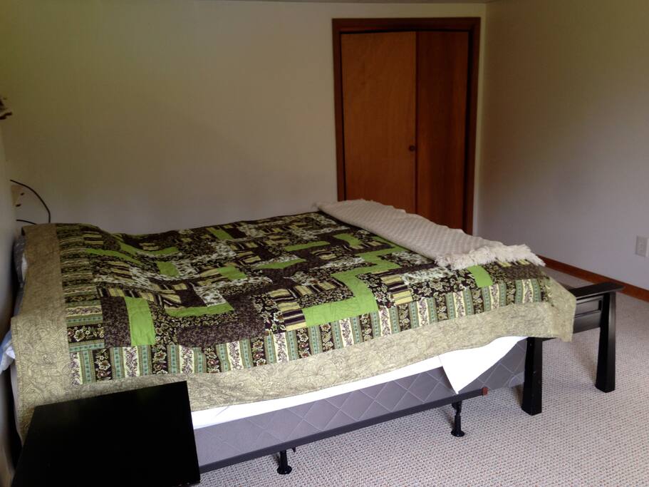 Queen-sized bed and full closet