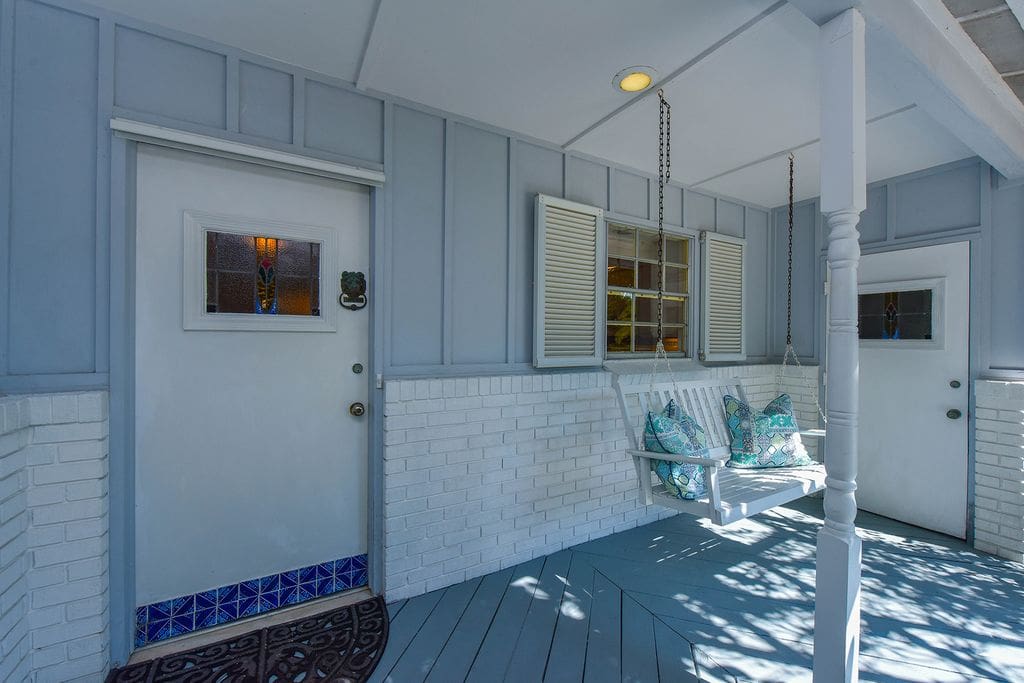 Siesta Key Beach Guesthouse front view - detail showing porch swing