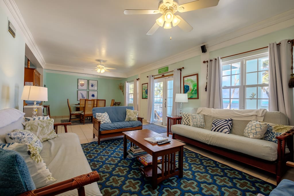 Gorgeous, cool living room with french doors that lead directly to your front porch.