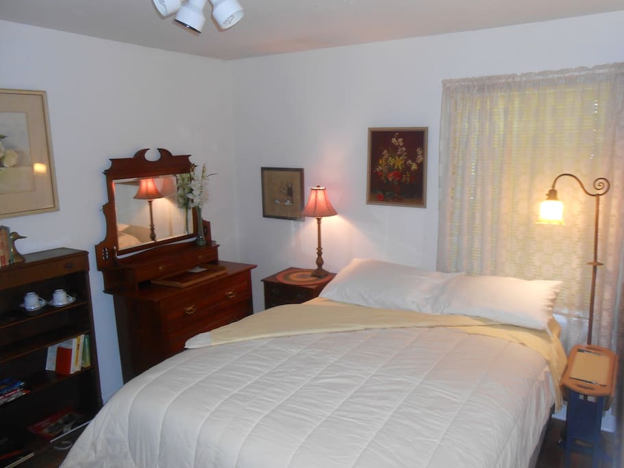 Quiet back bedroom with two windows. Adjacent to bathroom.