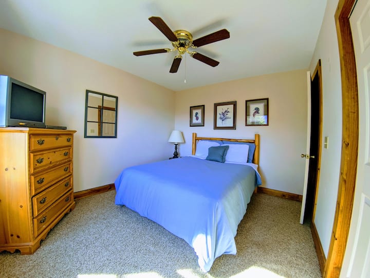 The main floor bedroom 2 features a QUEEN size bed with a TV and DVD player.