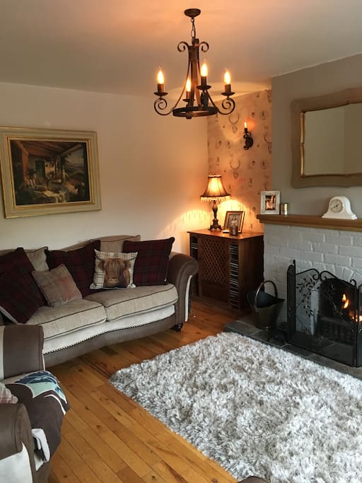 Enjoy our cosy sitting room with an open log fire.
