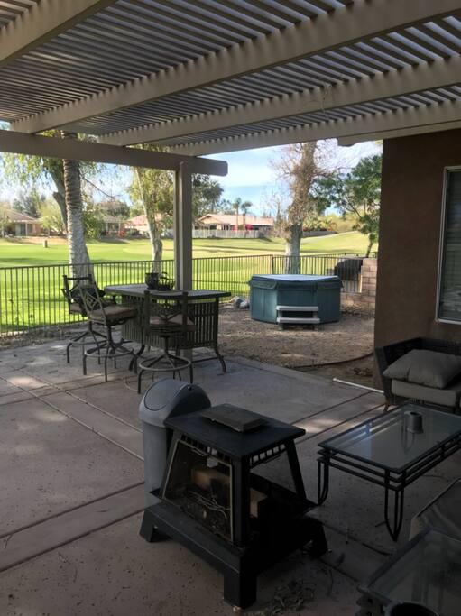 Backyard, Spa, Couches, TV, Firepit.