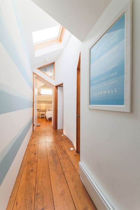 Hallway - love the floor lights, the skylights and the wallpaper - view into bedroom one