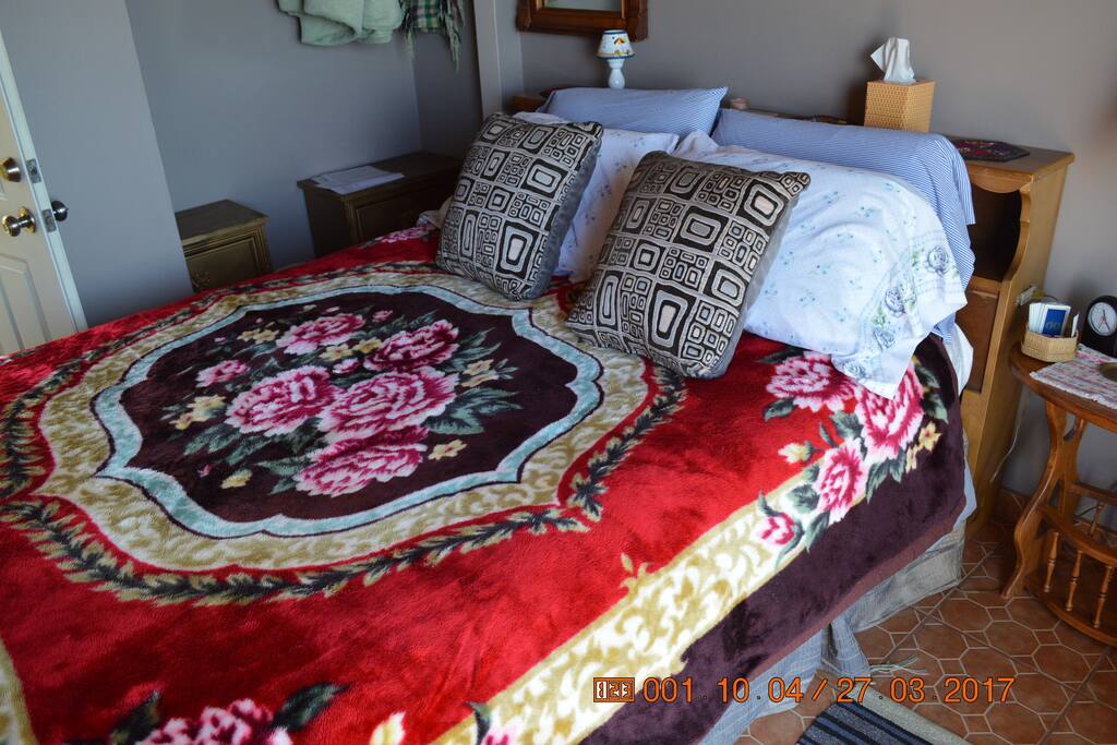 Comfortable queen bed in Bay room