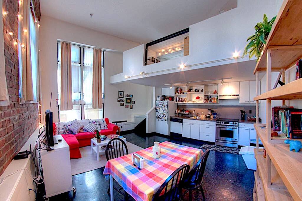 The kitchen has full-sized appliances, and is stocked with cookware and dinner ware.