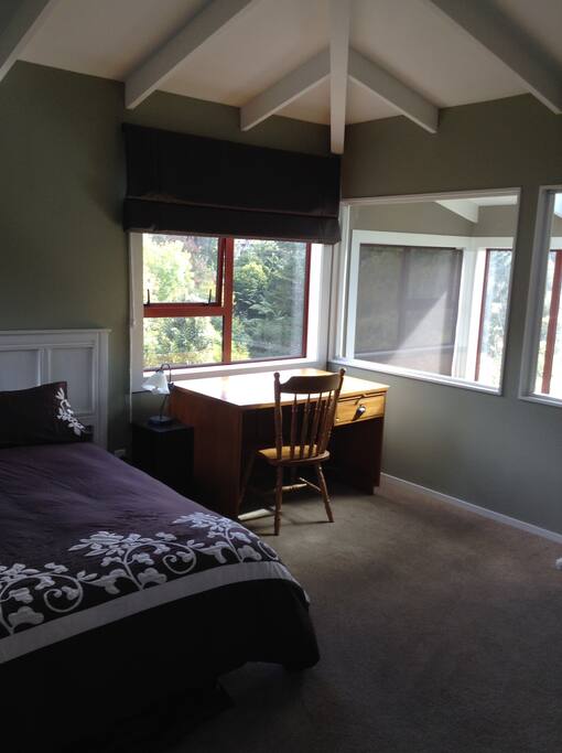 Larger second floor bedroom, desk and bush views