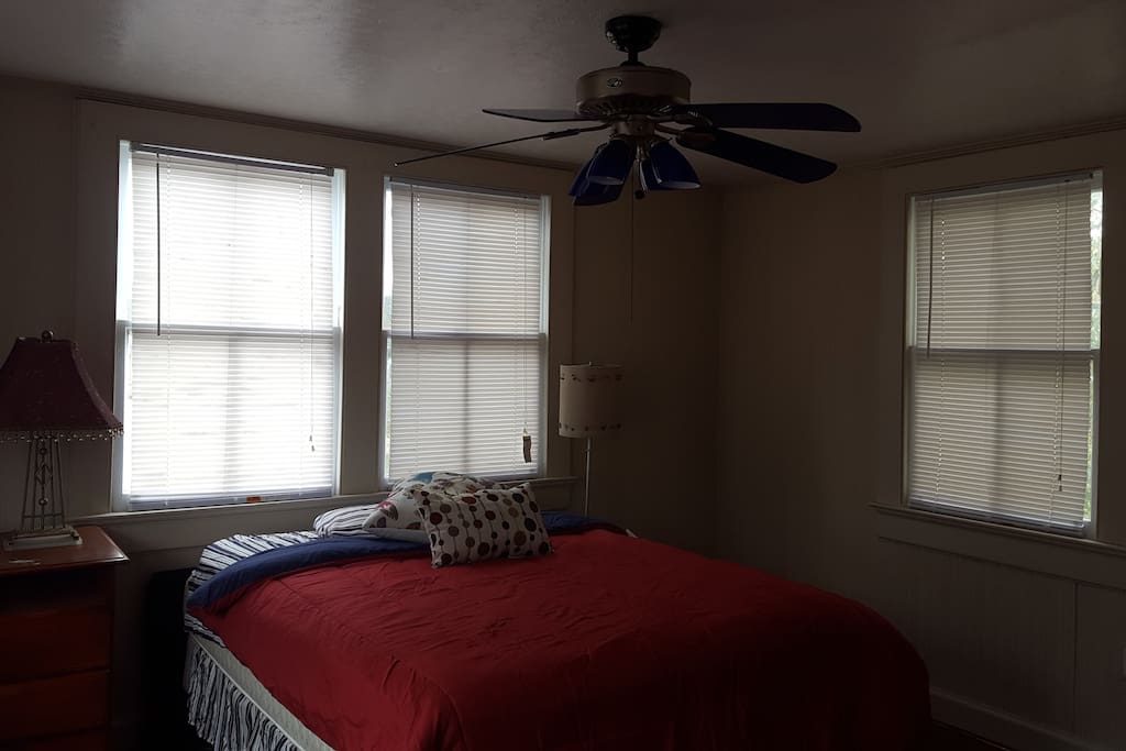 Bedroom No. 2 has full size bed, hardwood floors and ceiling fans.