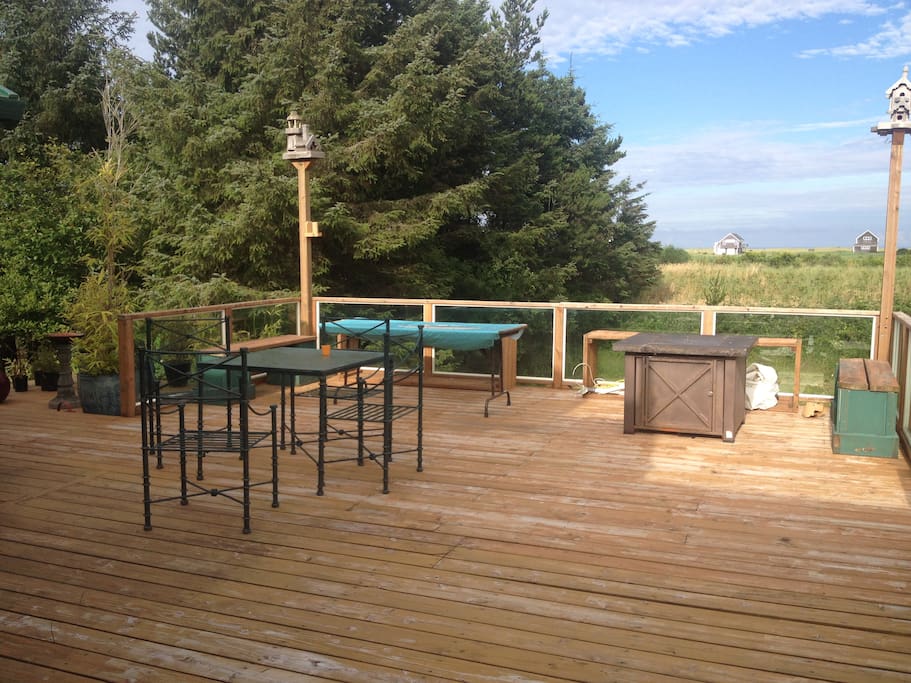 large outdoor space with propane fire pit and trail to the beach