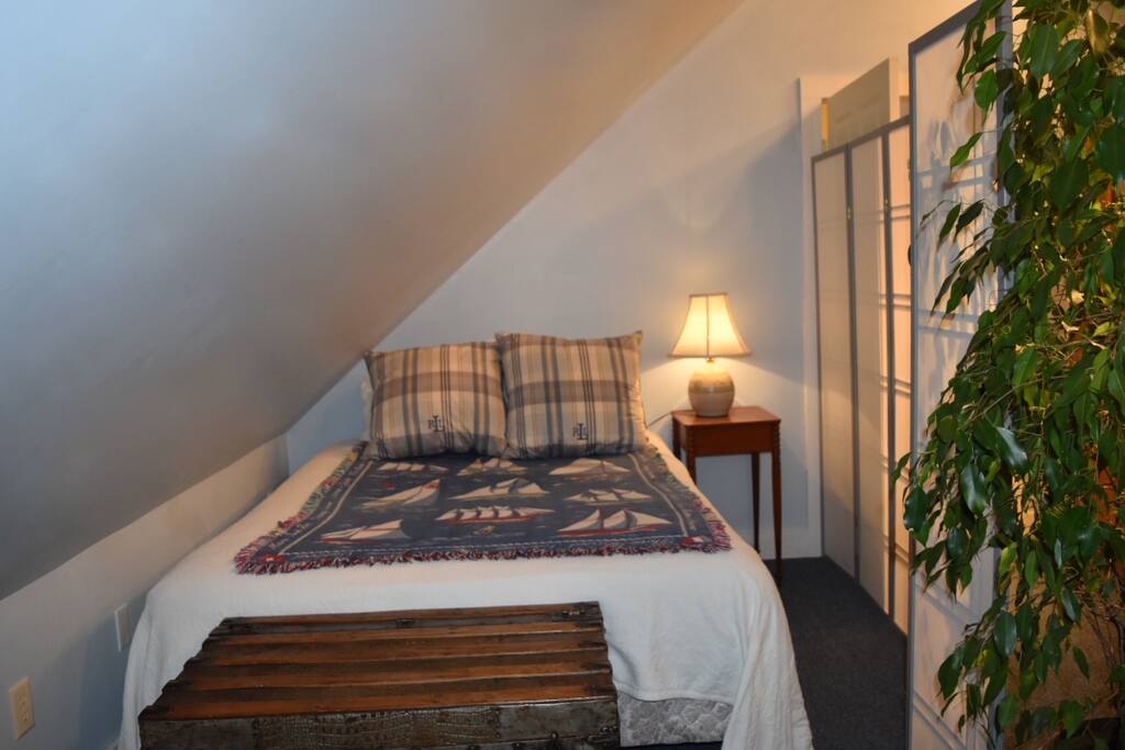 From the bed, you can look outside through the window and entrance door while still being behind the screen.
