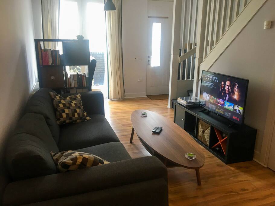 Recently decorated living room area with 40" 4K TV