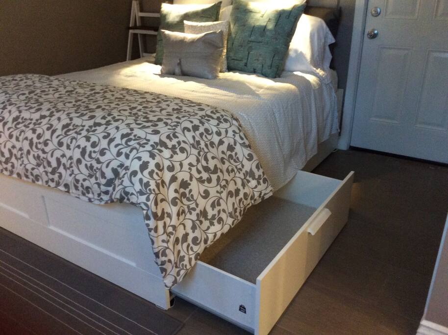 Under bed storage: four large drawers, each large enough to store a carry-on suitcase.