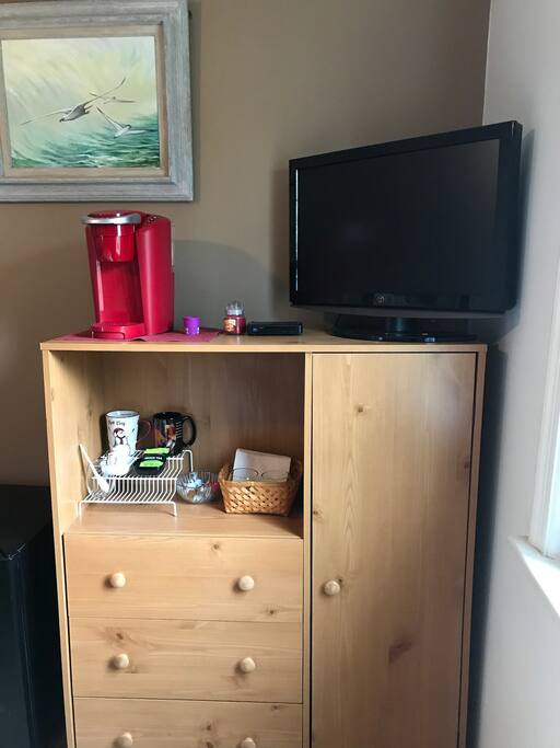 Coffee maker includes decaf and regular kcups. Also green tea packets are available.