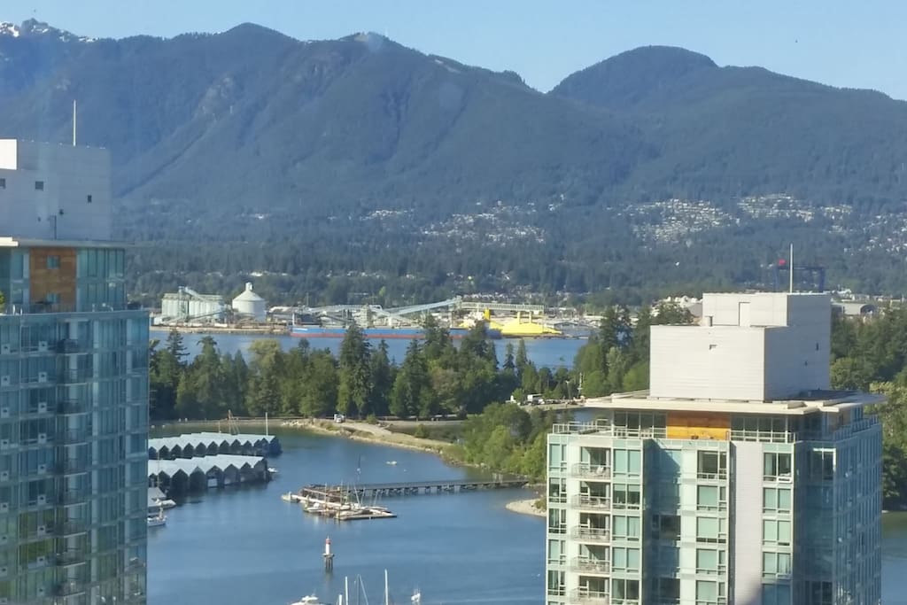 Breathtaking View of Coal Harbour, Stanley Park and North shore mountains.