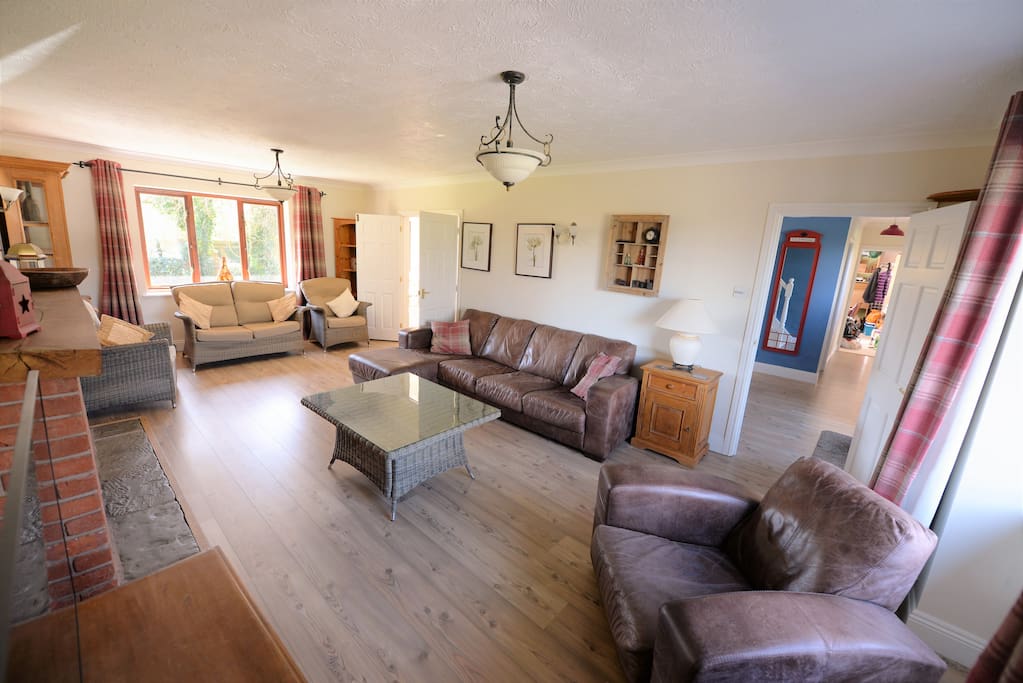 Main Lounge with windows at either end. 50" TV, DVD, stream movies / music from your devices.