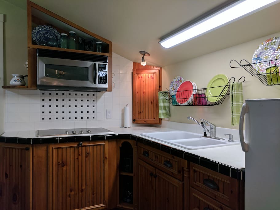 Kitchenette has a cook top, microwave and a small refrigerator.