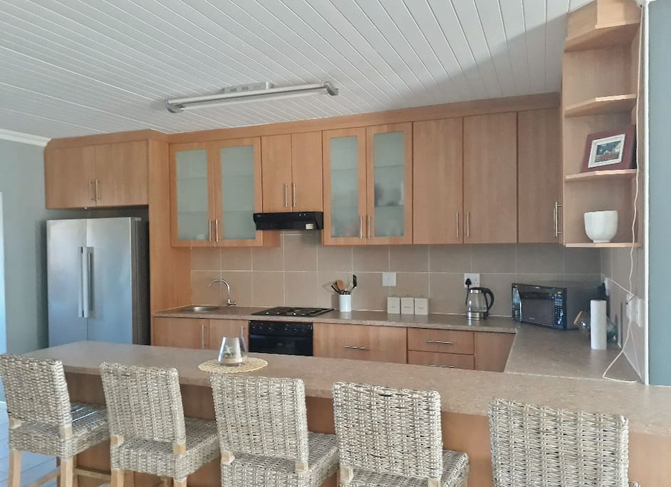 Open plan kitchen with all necessary appliances
