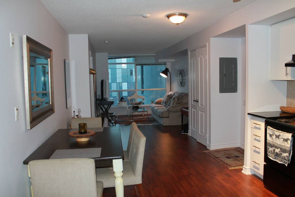 The living room opens onto a spacious kitchen and dining area