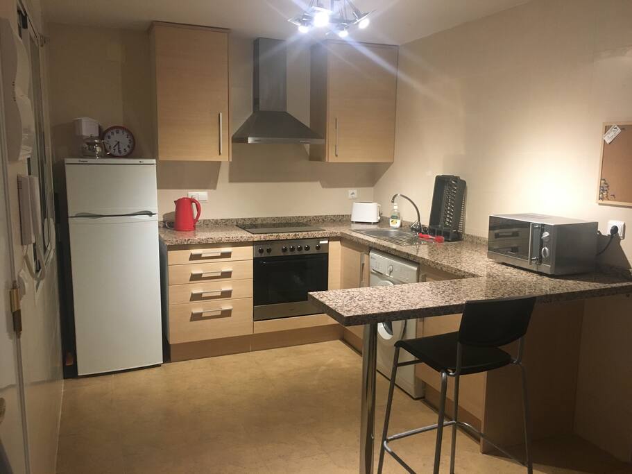 Fully fitted kitchen:
Washer, fridge freezer, oven, hob and extractor fan. Kettle & toaster. Granite worktops & breakfast bar and stool