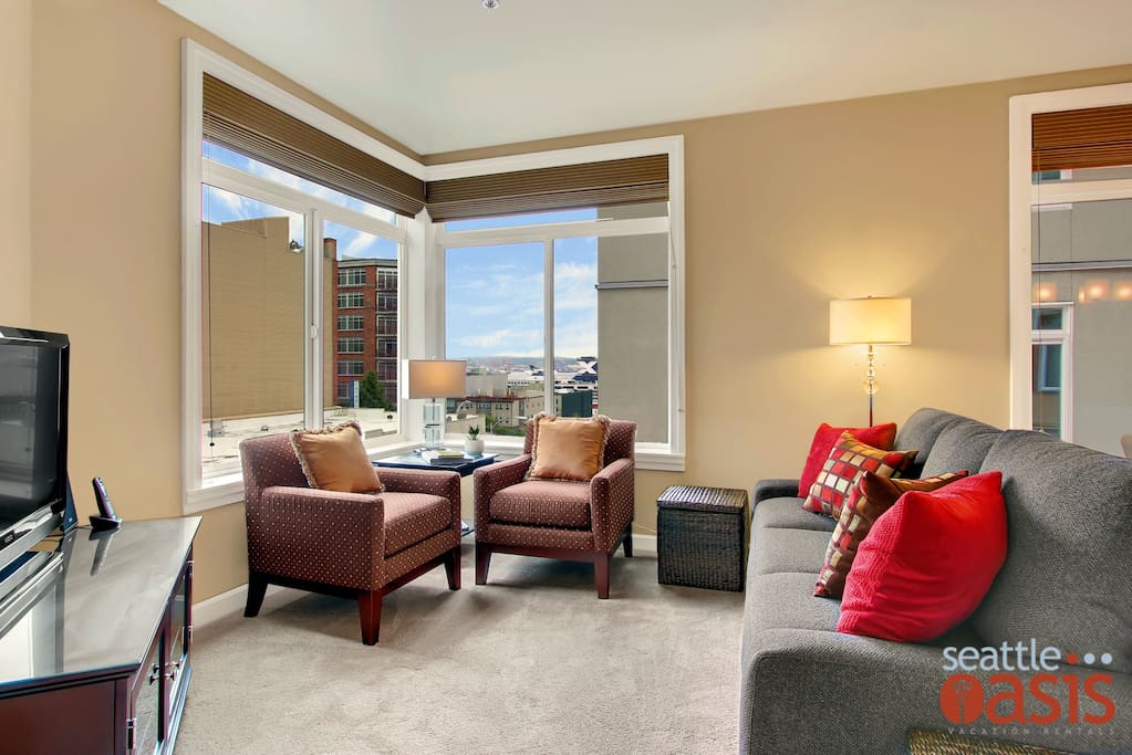 Lots of light comes into this corner unit with a peekaboo view of Elliott Bay