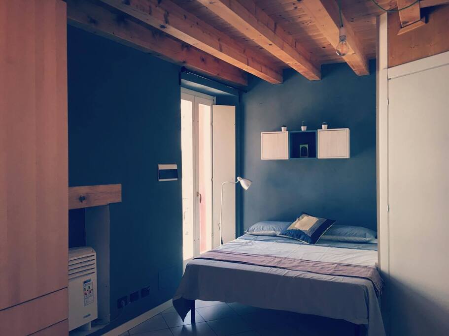 There is a big wardrobe, and a big and confortabile bed. No terrace but plenty of natural light coming in from two big windows and a air conditioning system.